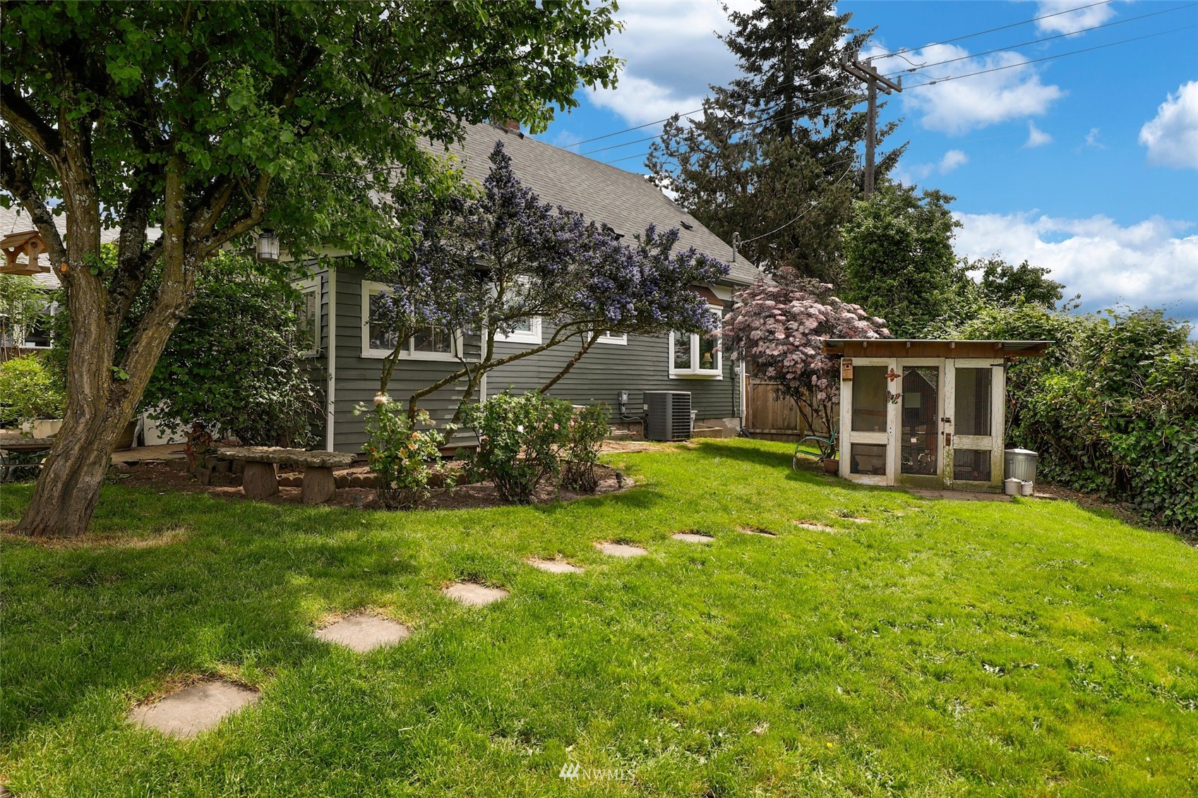 1010 South Director Street Seattle, WA 98108 - Photo 34 of 40 a view of a house with a big yard and large trees