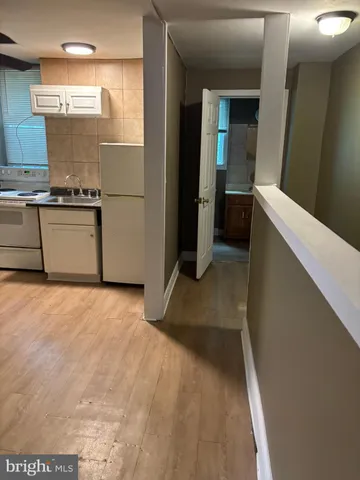 a view of a kitchen with a sink