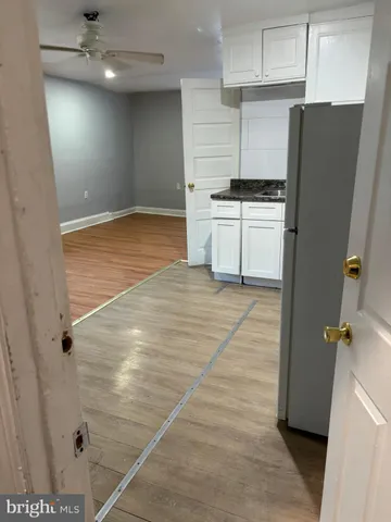 a view of a backyard with furniture and a fire pit