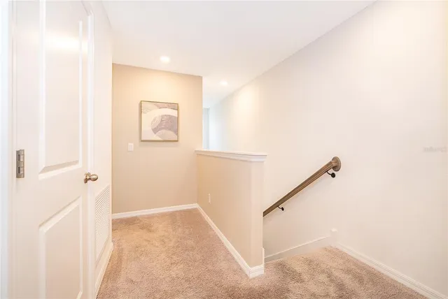 a view of a hallway with staircase