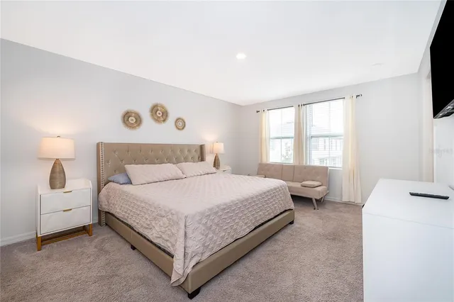 a bedroom with a bed and window