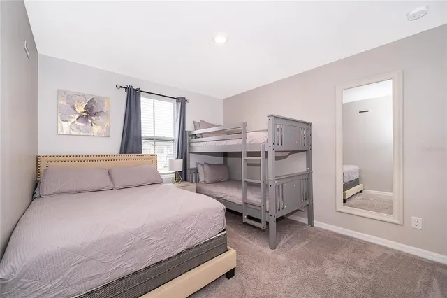 a bedroom with a bed and a cabinets