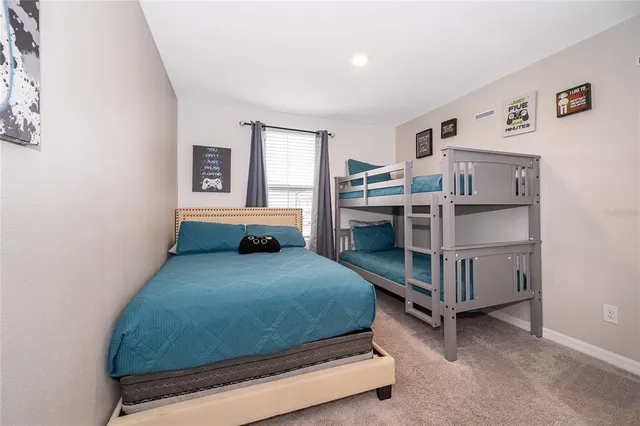 a bedroom with a bed and cabinets