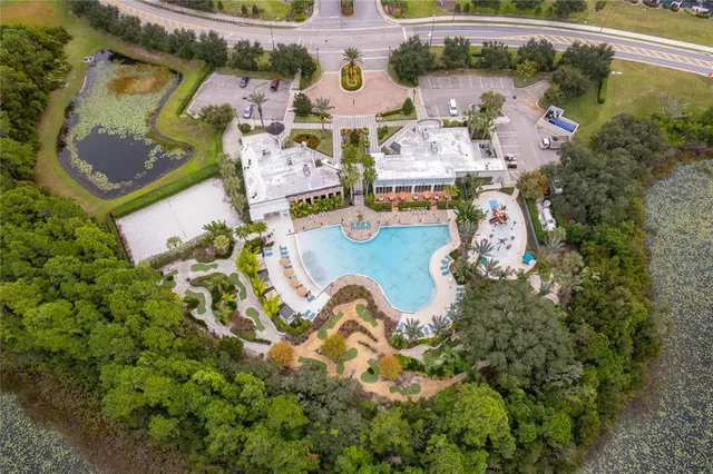 an aerial view of a house with a swimming pool