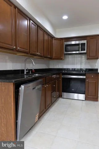 a white toilet next to a bathroom