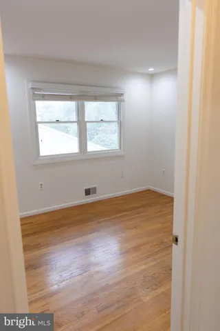 a bathroom with a sink a shower and a mirror