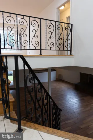 a bathroom with a toilet a sink and a window