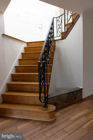 a view of house with a yard chairs and table in patio