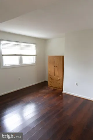 a view of a house with a yard in front of it