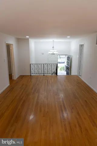 a view of balcony with wooden floor and outdoor seating