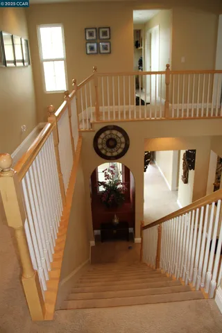 a view of entryway livingroom and hall with wooden floor
