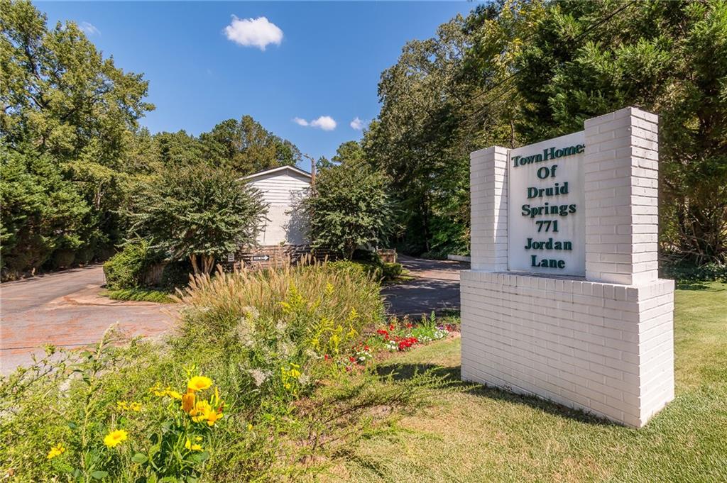 771 Jordan Lane, Unit D Decatur, GA 30033 - Photo 1 of 1 a view of potted plants and tree next to a yard