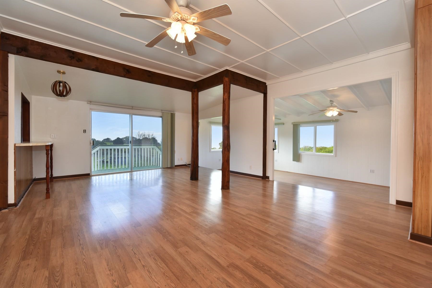 1145 Olinda Road Makawao, HI 96768 - Photo 11 of 30 a view of an empty room with wooden floor and a window