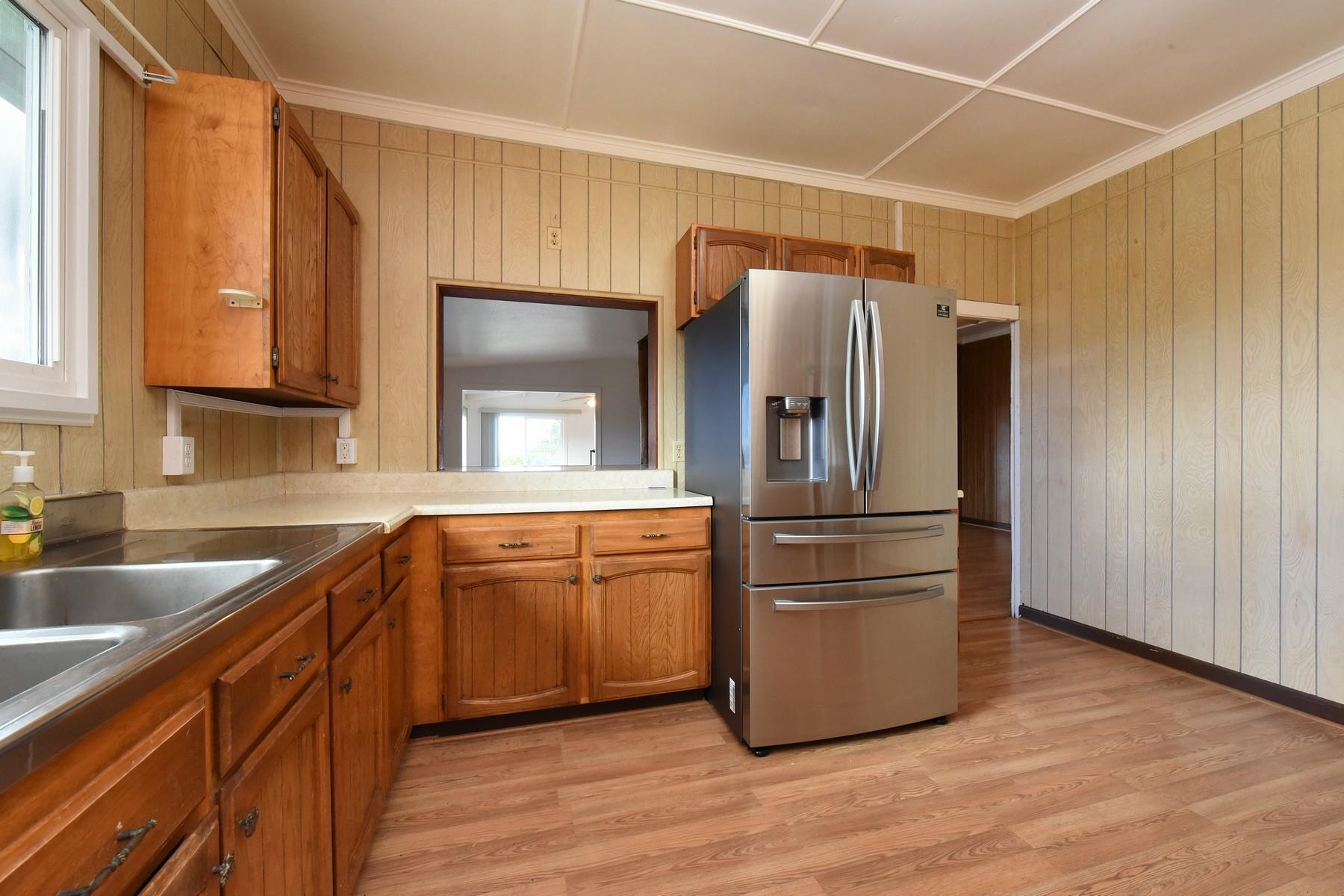 1145 Olinda Road Makawao, HI 96768 - Photo 13 of 30 a kitchen with stainless steel appliances granite countertop a refrigerator a sink and dishwasher