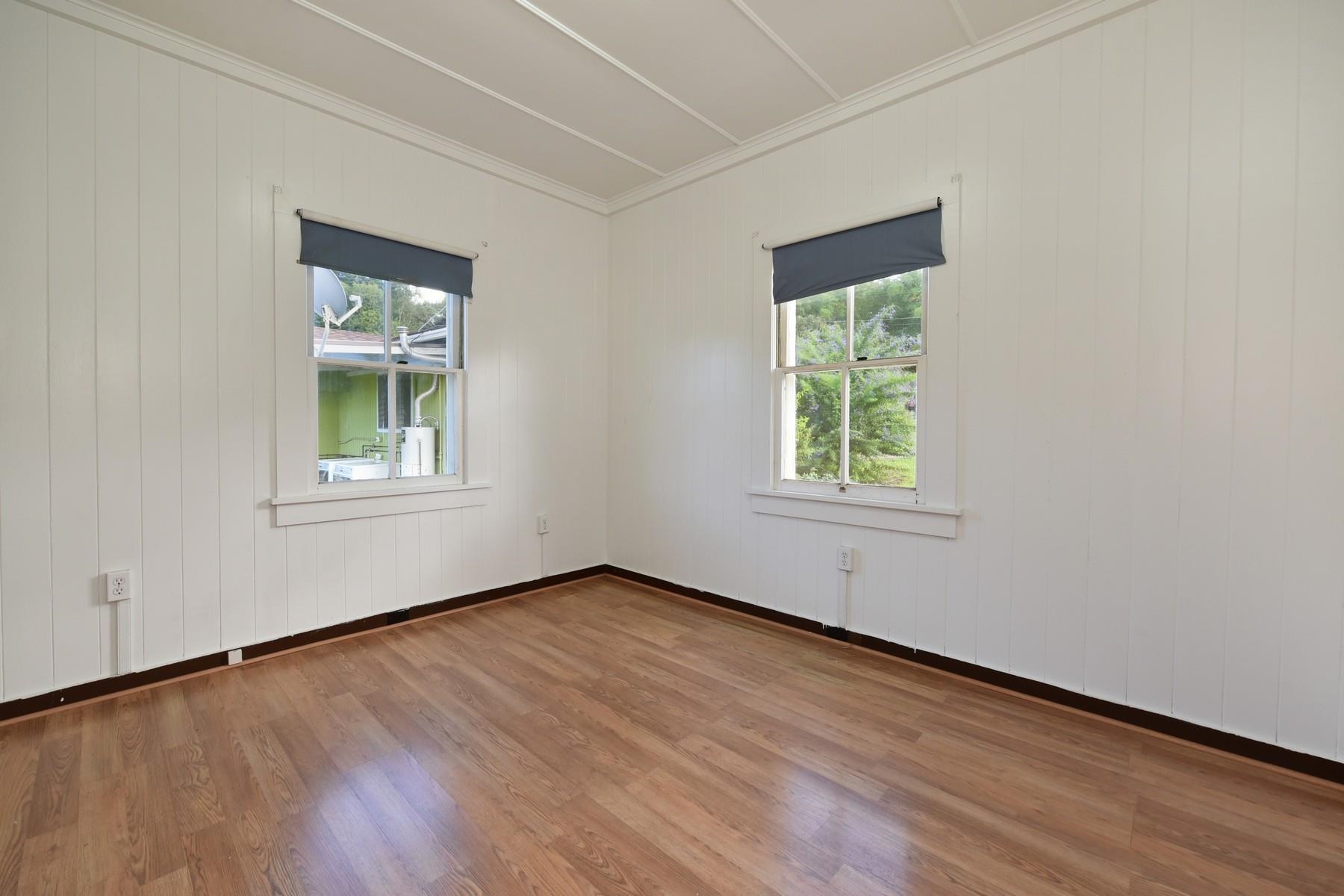 1145 Olinda Road Makawao, HI 96768 - Photo 18 of 30 an empty room with wooden floor and windows