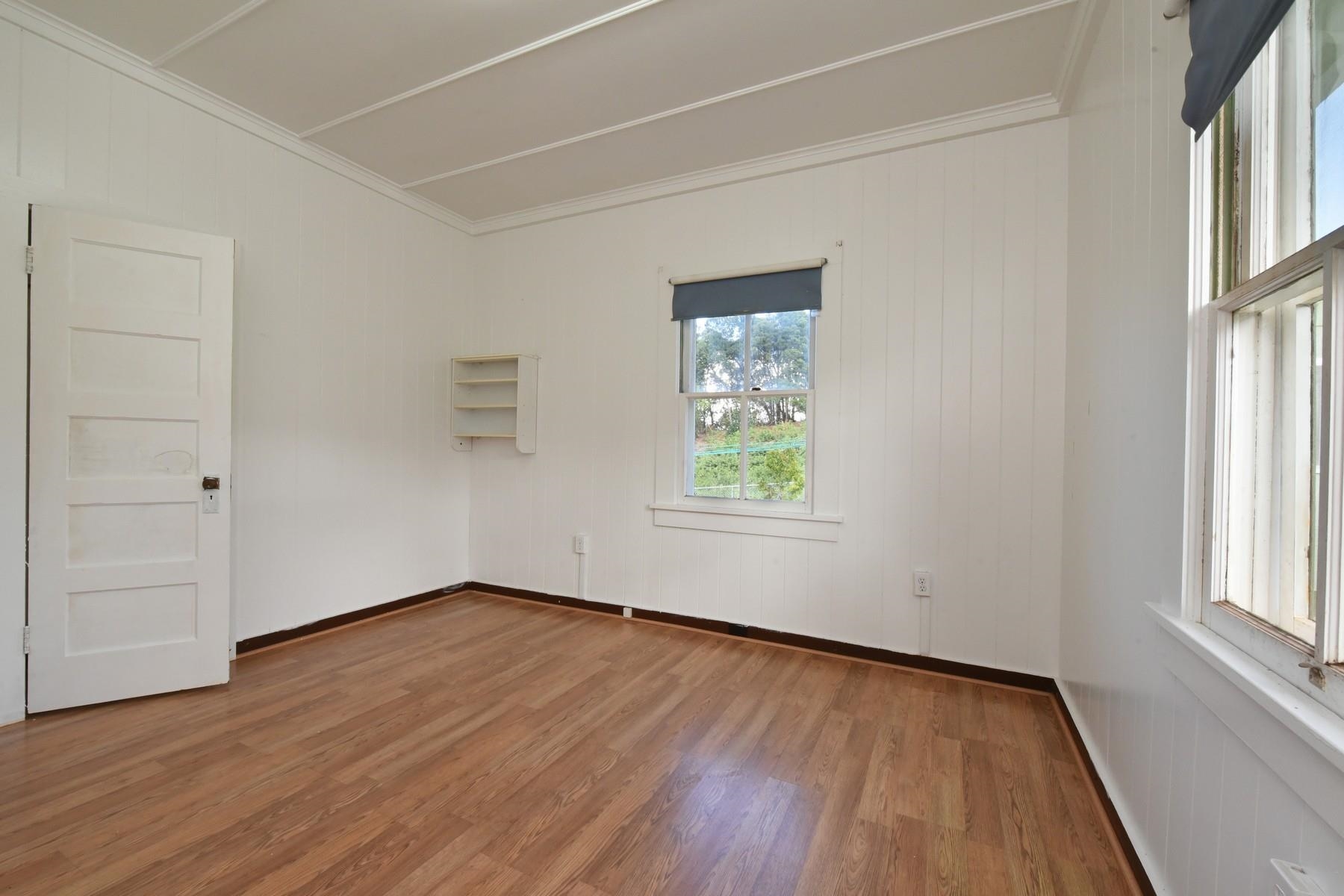 1145 Olinda Road Makawao, HI 96768 - Photo 19 of 30 an empty room with wooden floor and windows