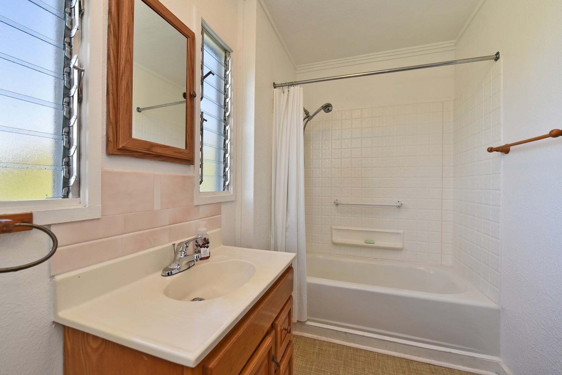 1145 Olinda Road Makawao, HI 96768 - Photo 29 of 30 a bathroom with a sink vanity tub and a mirror
