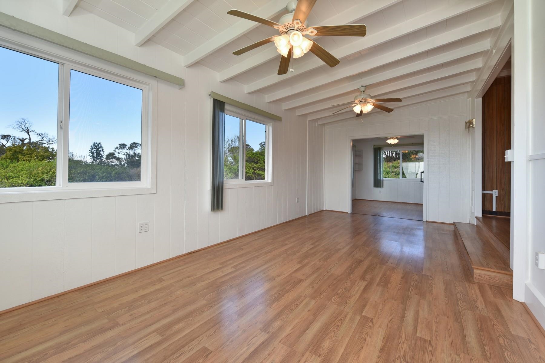 1145 Olinda Road Makawao, HI 96768 - Photo 7 of 30 a view of an empty room with wooden floor and a window