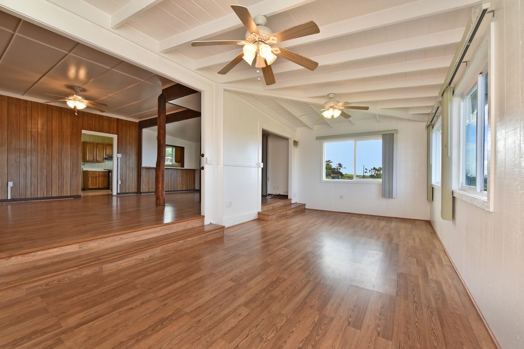 1145 Olinda Road Makawao, HI 96768 - Photo 8 of 30 wooden floor in an empty room with a window