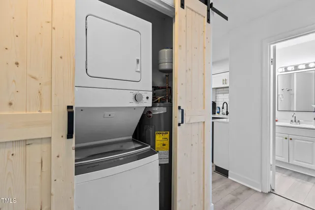a view of storage and utility room with closet