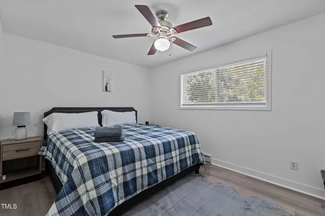 a bedroom with a bed and window