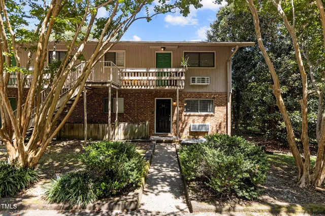 front view of a house with a garden