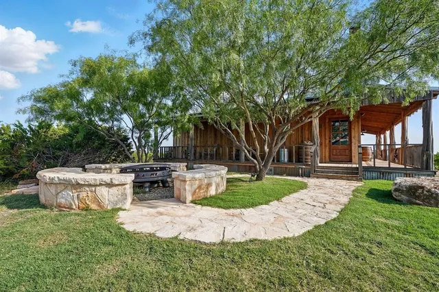 a view of a swimming pool with a yard