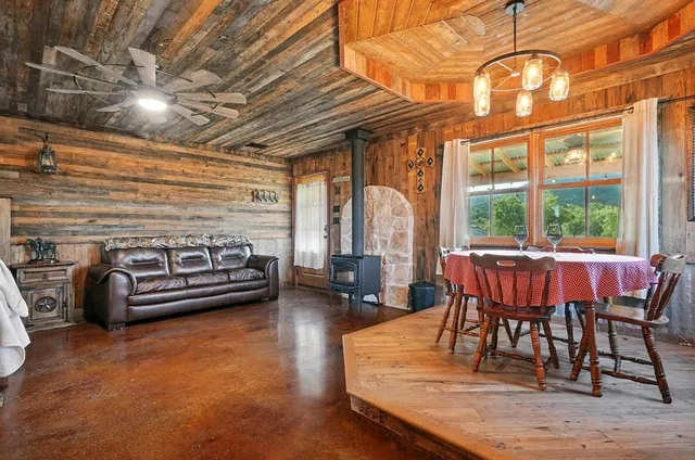 a view of a porch with furniture and garden