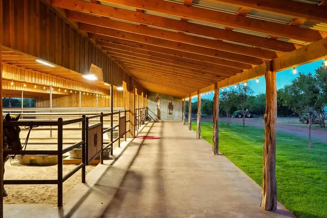 an aerial view of residential houses with outdoor space and ocean view