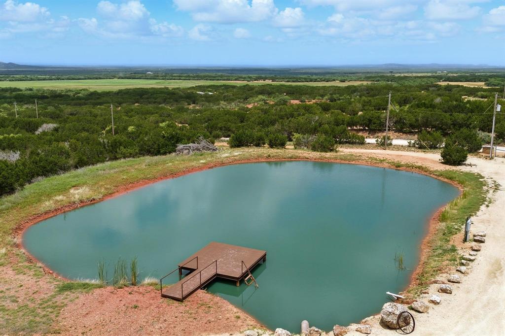635 County Road 184 Winters, TX 79567 - Photo 22 of 40 Drone / aerial view of a large body of water and a heavily wooded area