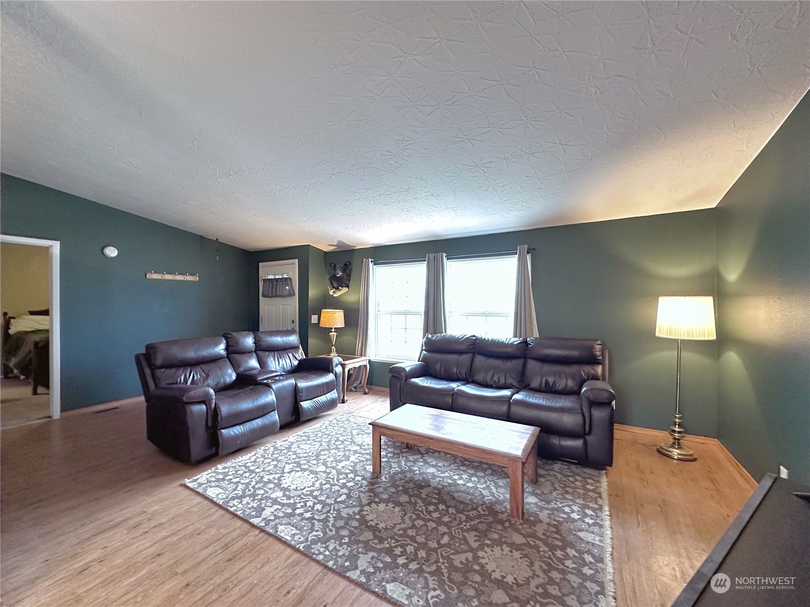 147 Riverside Cutoff Road Riverside, WA 98849 - Photo 4 of 37 a living room with furniture and wooden floor