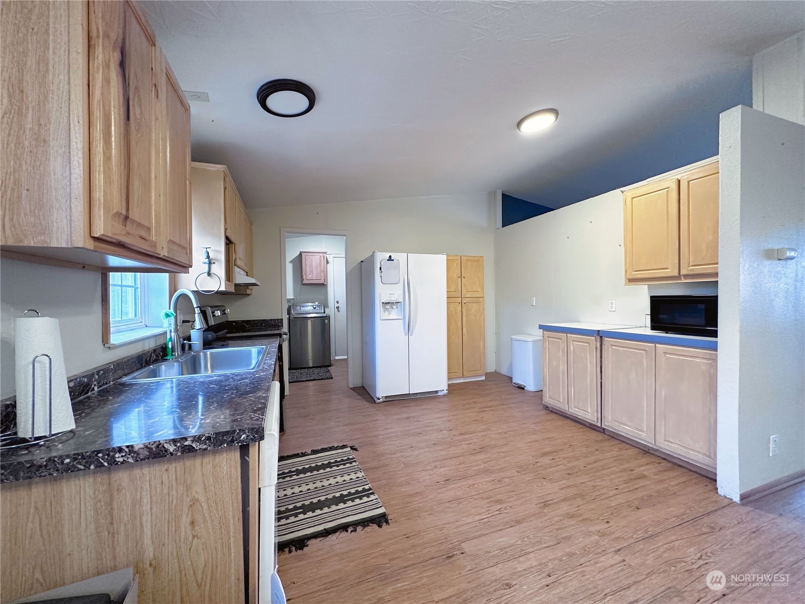 147 Riverside Cutoff Road Riverside, WA 98849 - Photo 8 of 37 a kitchen with stainless steel appliances granite countertop a stove and a refrigerator