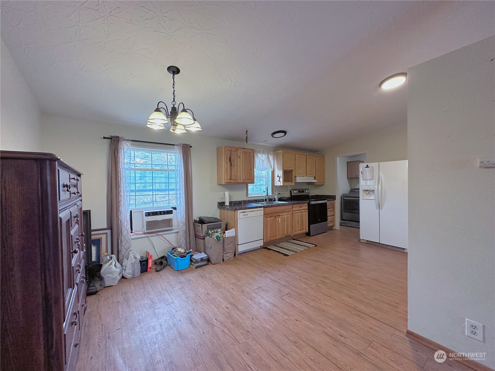 147 Riverside Cutoff Road Riverside, WA 98849 - Photo 10 of 37 a view of kitchen with cabinets and wooden floor