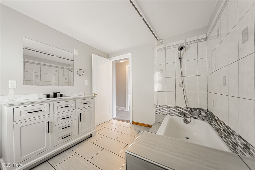 1271 Winston Road Cleveland, OH 44121 - Photo 31 of 43 Bathroom featuring vanity and tile patterned flooring
