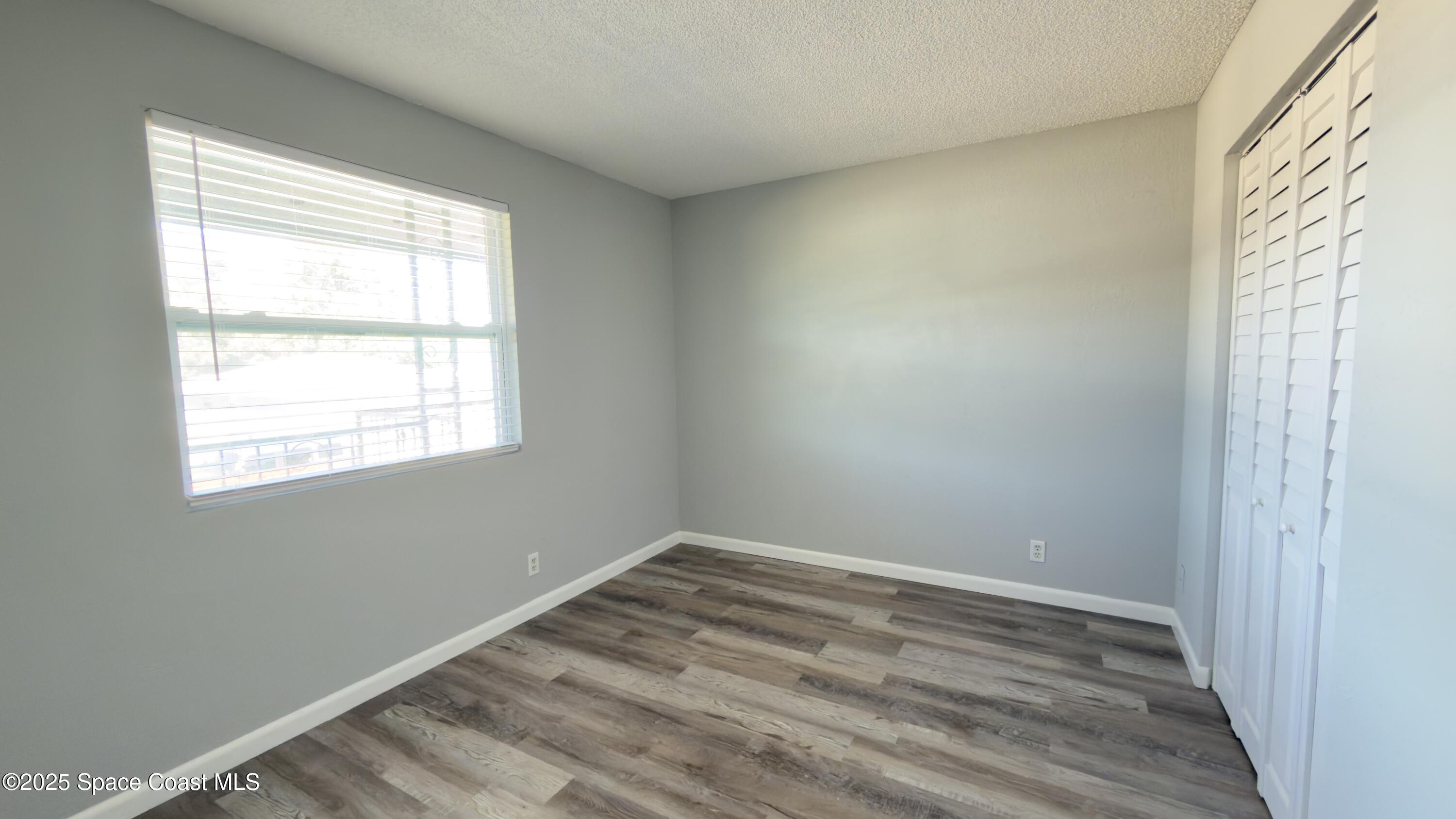4160 Barna Avenue, Unit C Titusville, FL 32780 - Photo 12 of 14 a view of a room that has a window in it