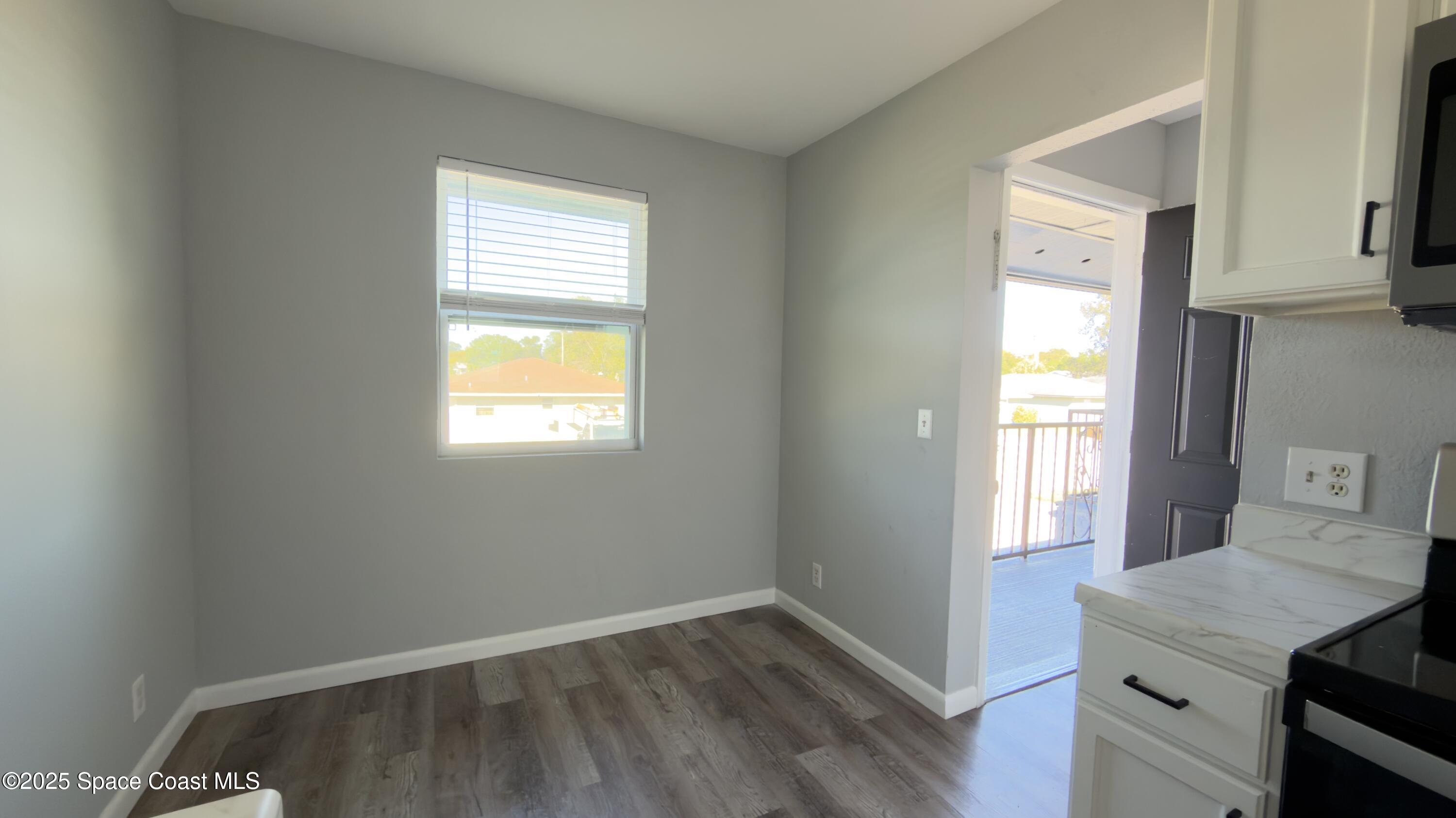 4160 Barna Avenue, Unit C Titusville, FL 32780 - Photo 8 of 14 a view of a room that has a window in it