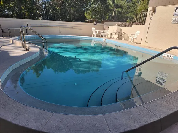 a view of swimming pool from a balcony