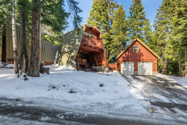 a living room with furniture a flat screen tv and a large window