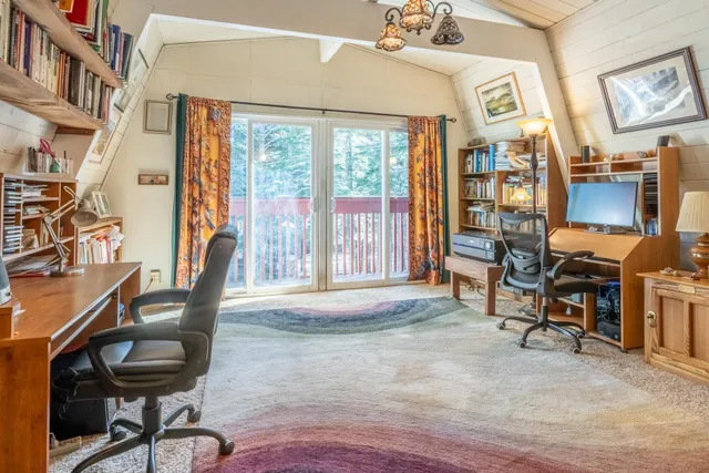 a view of a porch with wooden floor