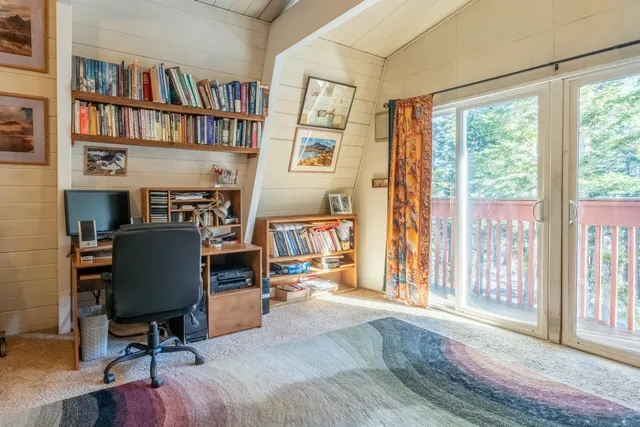 a view of a porch with wooden floor