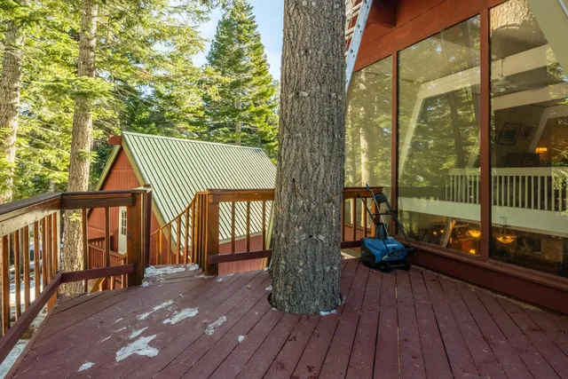 a view of a porch with wooden floor and furniture