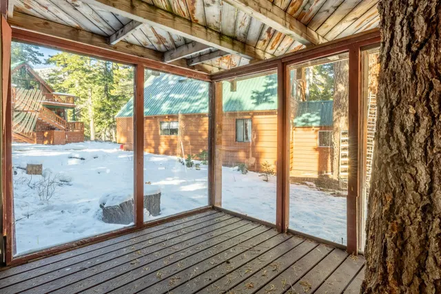a view of balcony with wooden floor