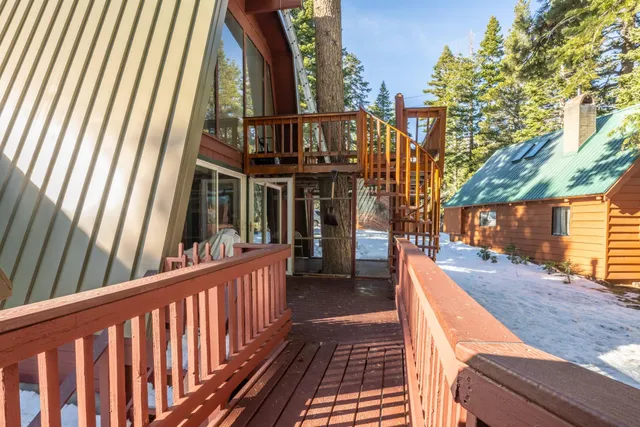 a view of a car park in front of a house