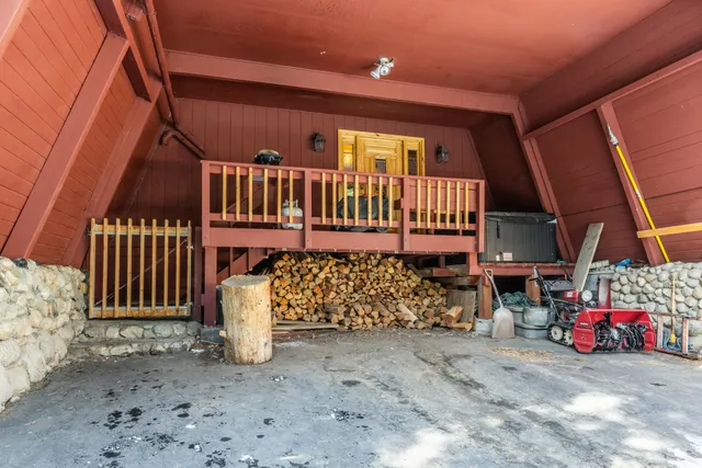 a view of a balcony with wooden floor and fence
