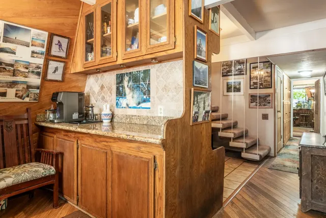 a view of a dining room with furniture wooden floor and chandelier