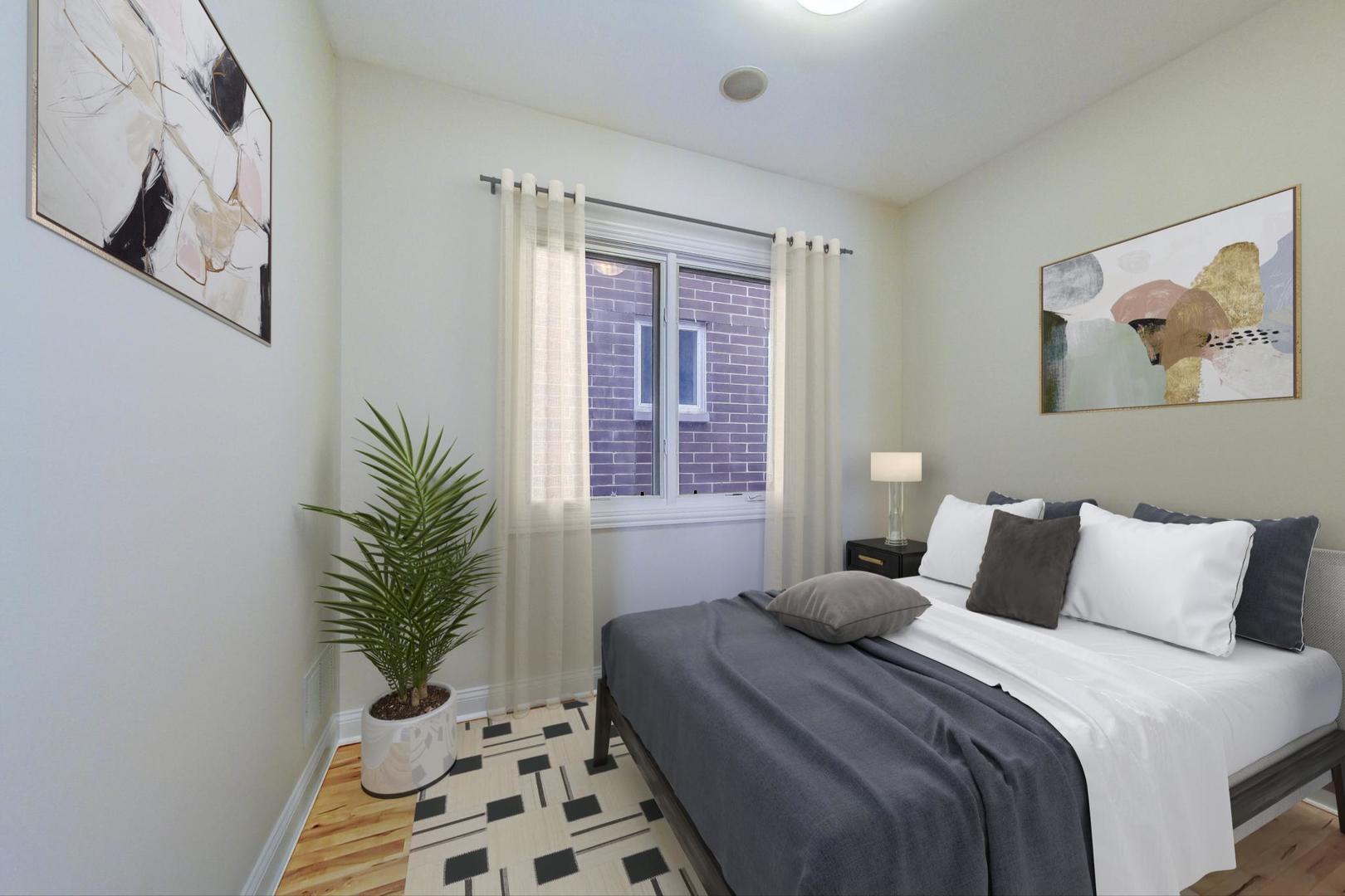 2448 West Augusta Boulevard, Unit 2 Chicago, IL 60622 - Photo 15 of 23 a bedroom with a bed and a potted plant