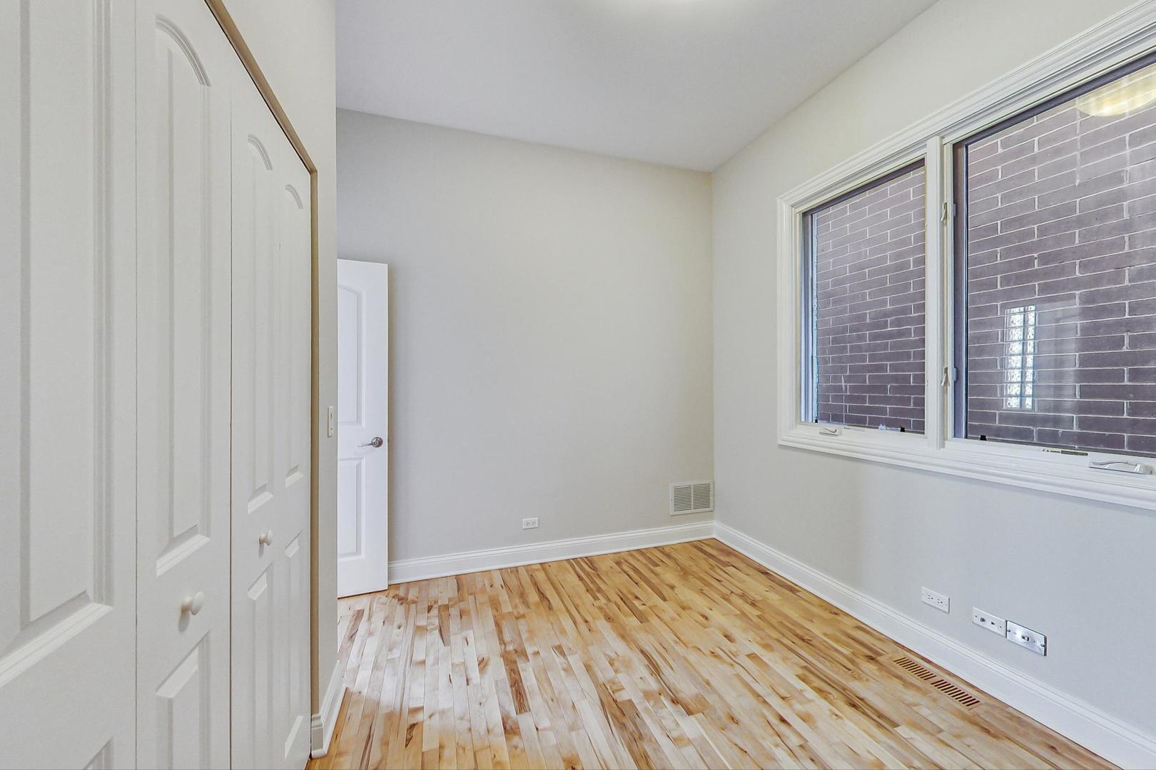 2448 West Augusta Boulevard, Unit 2 Chicago, IL 60622 - Photo 19 of 23 a view of a room with wooden floor and a window