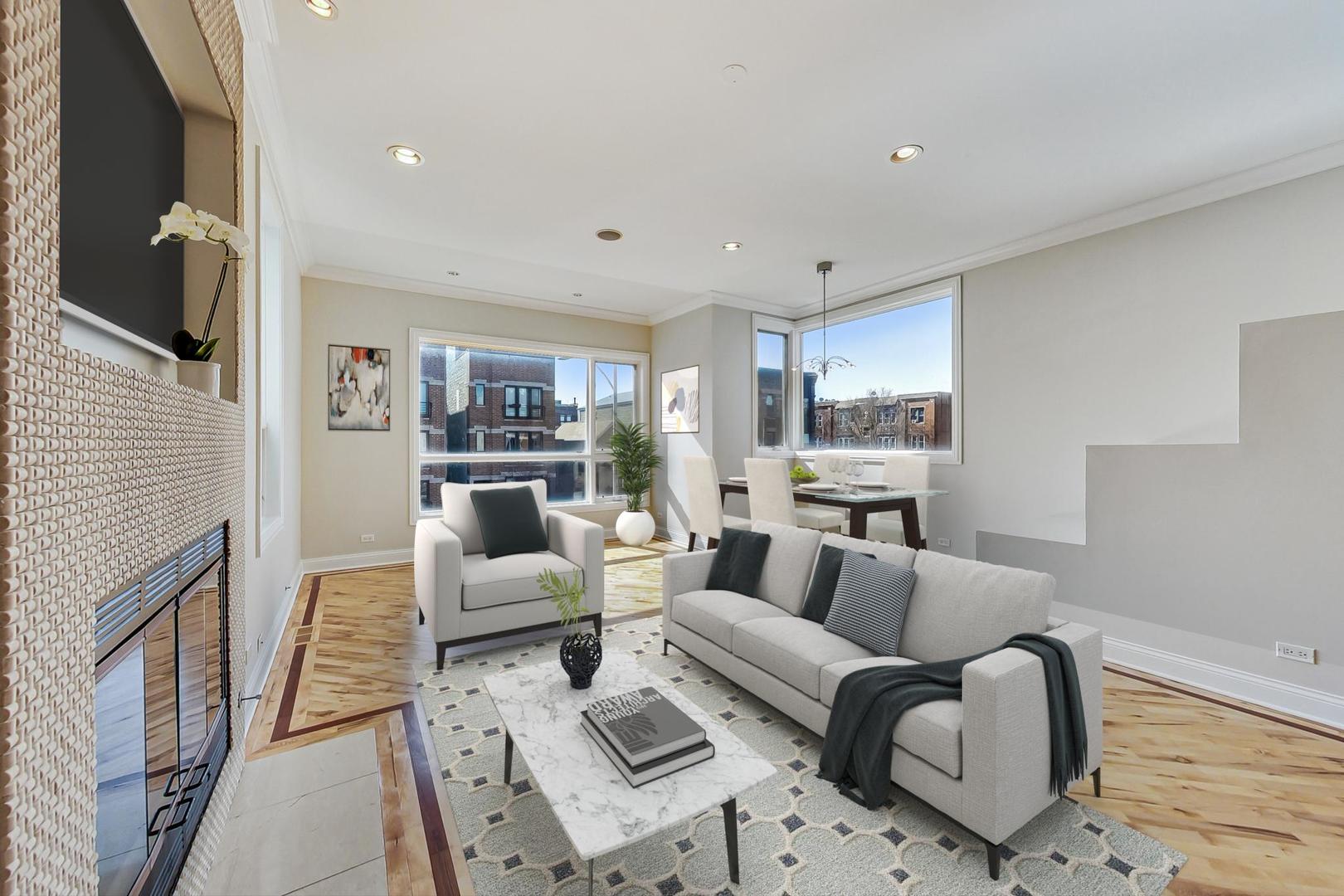 2448 West Augusta Boulevard, Unit 2 Chicago, IL 60622 - Photo 2 of 23 a living room with furniture or couch and a fireplace