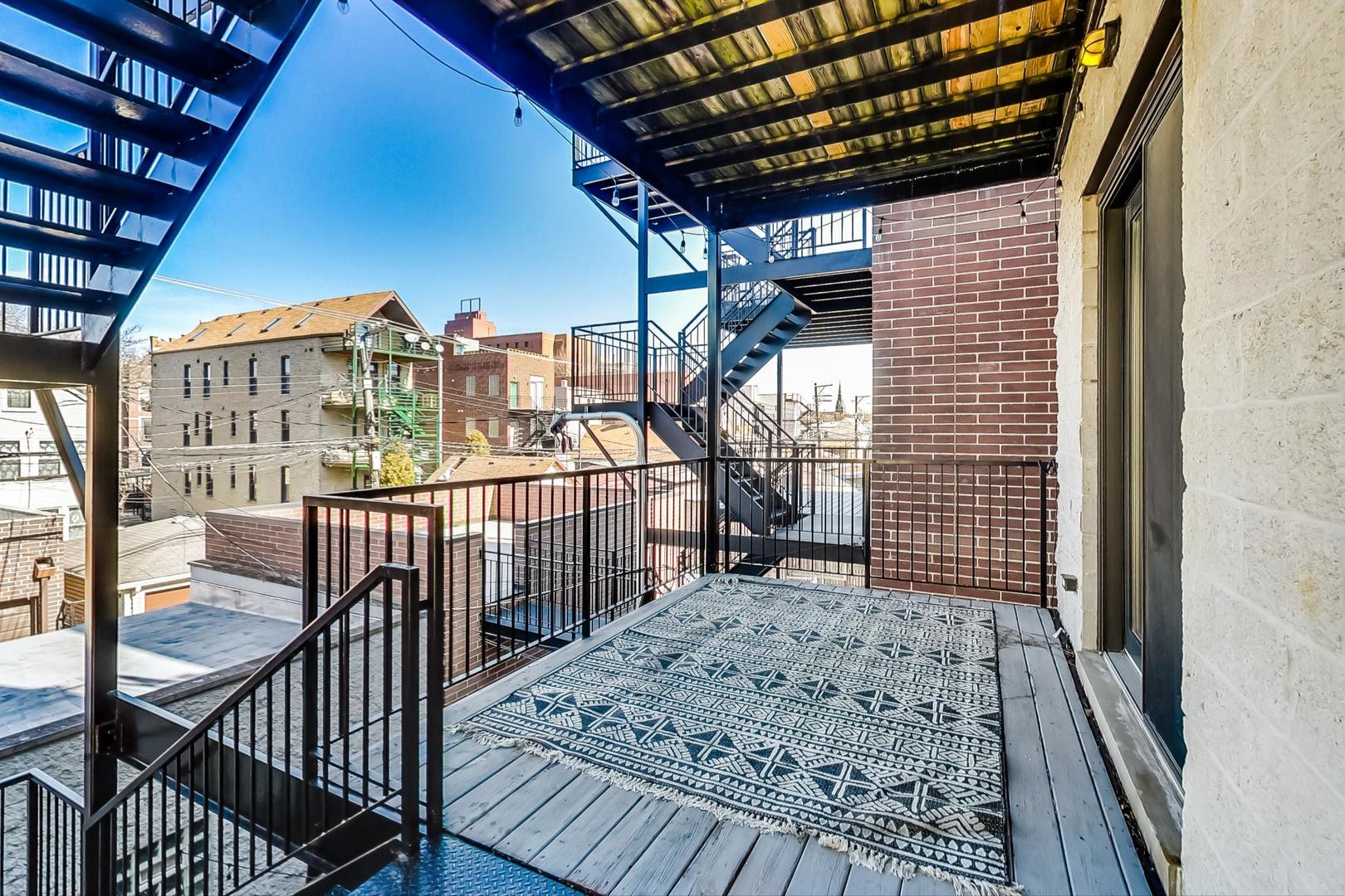 2448 West Augusta Boulevard, Unit 2 Chicago, IL 60622 - Photo 21 of 23 a view of a balcony with furniture
