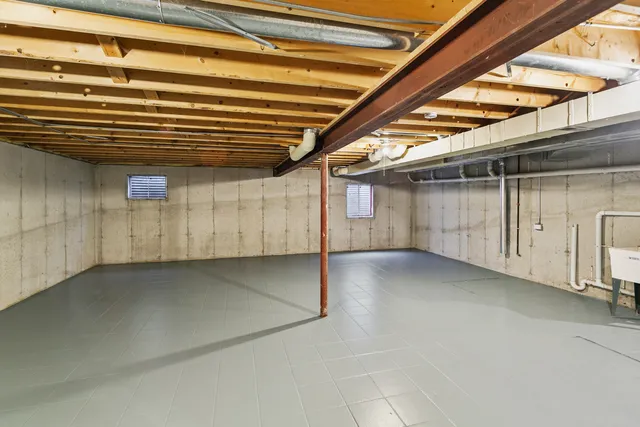 a view of a room with wooden walls